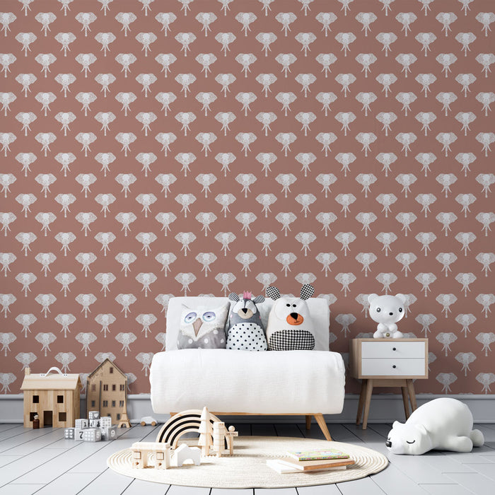 Une chambre d'enfant avec un papier peint rose terracotta orné de motifs d'éléphants blancs, créant une atmosphère douce et ludique.