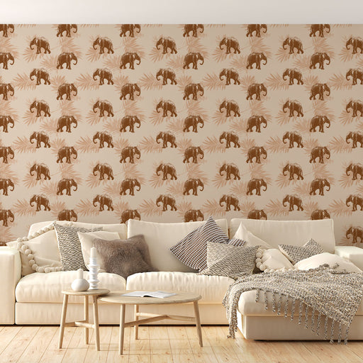 Un salon lumineux avec un papier peint représentant des éléphants bruns sur fond beige, agrémenté de motifs de feuilles, créant une ambiance chaleureuse et exotique.