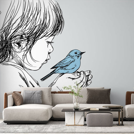Un salon contemporain avec un papier peint artistique représentant un enfant en silhouette noire tenant un oiseau bleu, créant une atmosphère douce et poétique.