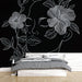 Papier peint silhouette féminine avec motifs floraux blancs sur fond noir pour chambre moderne