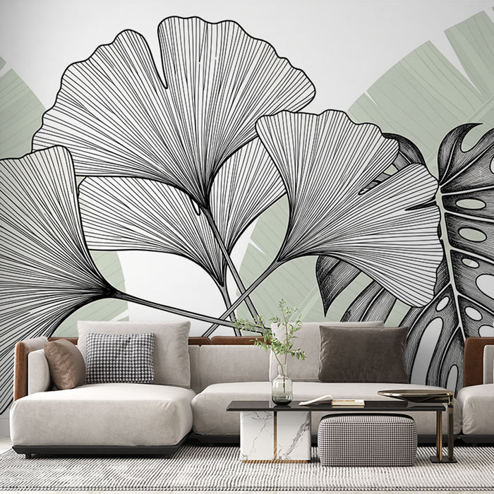 Un salon moderne avec un papier peint botanique représentant des feuilles de ginkgo et de monstera en noir sur un fond pastel, créant une atmosphère apaisante et naturelle.
