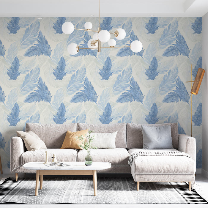Un salon moderne avec un papier peint représentant de grandes feuilles bleues sur fond crème, créant une ambiance apaisante et naturelle.
