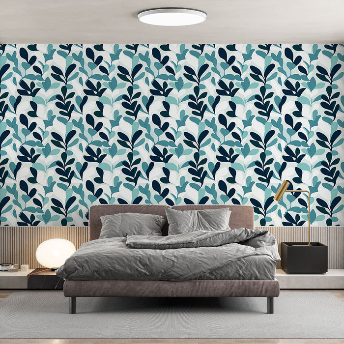 Une chambre moderne avec un papier peint aux motifs de feuillage stylisé dans des teintes de bleu et vert, créant une ambiance fraîche et apaisante.