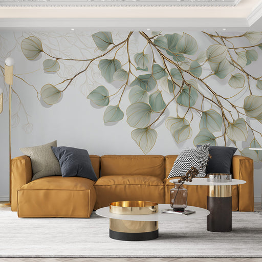 Un salon contemporain avec un papier peint aux motifs de feuilles délicates dans des teintes vertes et dorées, créant une atmosphère apaisante et élégante.