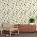 Une pièce moderne avec un papier peint floral représentant des feuilles vertes sur fond clair, créant une atmosphère apaisante et naturelle.