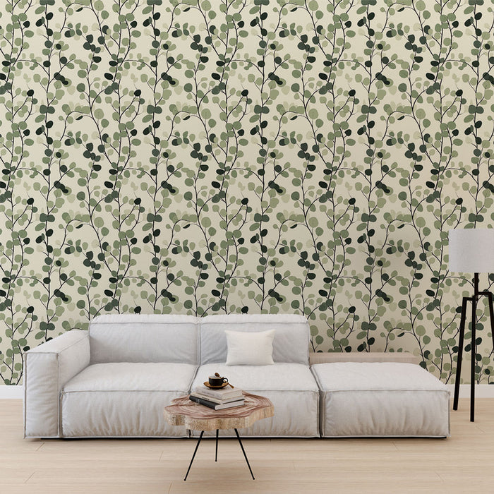 Un salon moderne avec un papier peint aux motifs de feuillage vert et noir sur fond clair, créant une ambiance naturelle et apaisante.