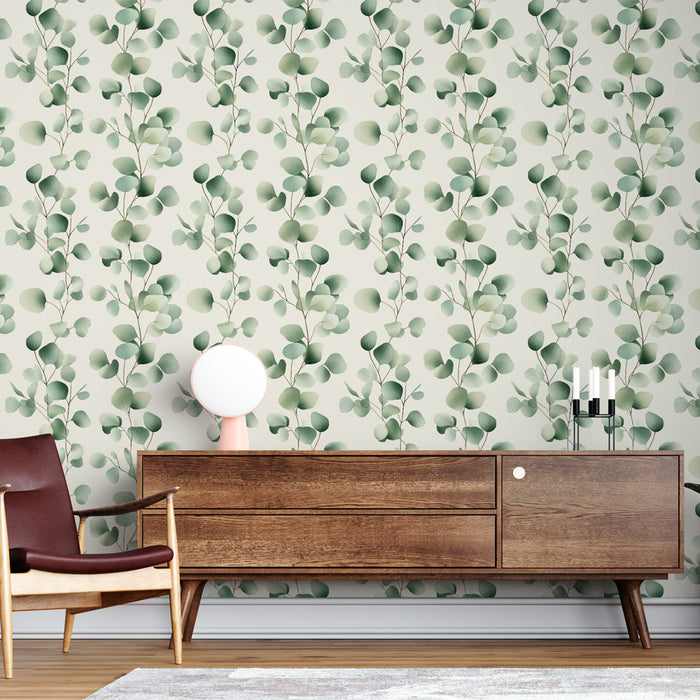 Un salon moderne avec un papier peint aux motifs de feuilles vertes délicates sur fond clair, créant une atmosphère apaisante et naturelle.