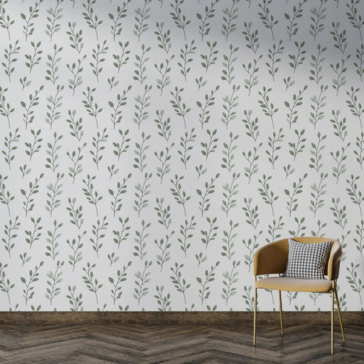 Une pièce moderne avec un papier peint floral aux motifs délicats de feuillage vert sur fond blanc, créant une ambiance fraîche et apaisante.