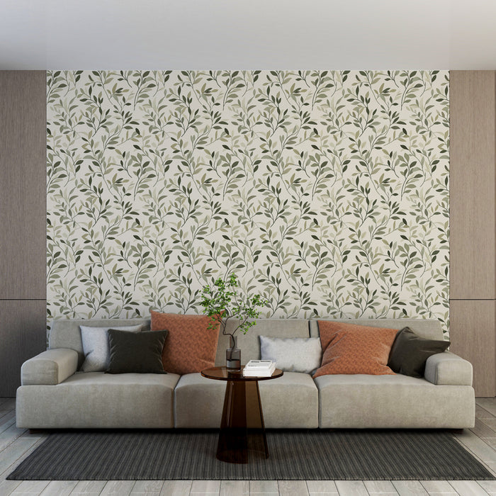 Un salon moderne avec un papier peint floral aux motifs de feuillage vert sur fond clair, créant une atmosphère apaisante et naturelle.