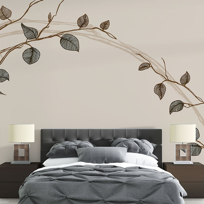 Une chambre moderne avec un papier peint aux motifs de branches délicates et de feuilles stylisées, créant une atmosphère apaisante et naturelle.