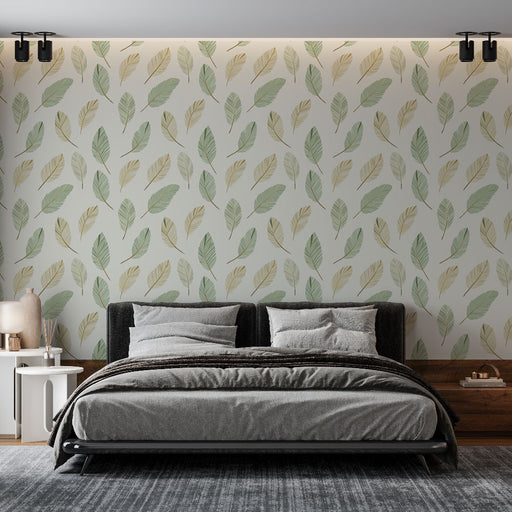 Une chambre moderne avec un papier peint aux motifs de feuilles délicates dans des teintes vertes et dorées, créant une ambiance naturelle et apaisante.