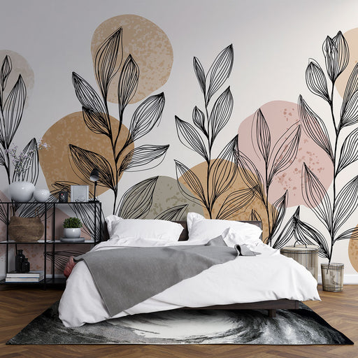 Une chambre moderne avec un papier peint illustrant des feuilles stylisées noires sur des cercles pastel, créant une ambiance douce et apaisante.