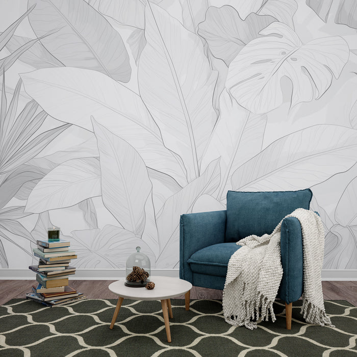 Une pièce moderne avec un papier peint monochrome représentant de grandes feuilles tropicales aux contours délicats, créant une atmosphère apaisante et élégante.