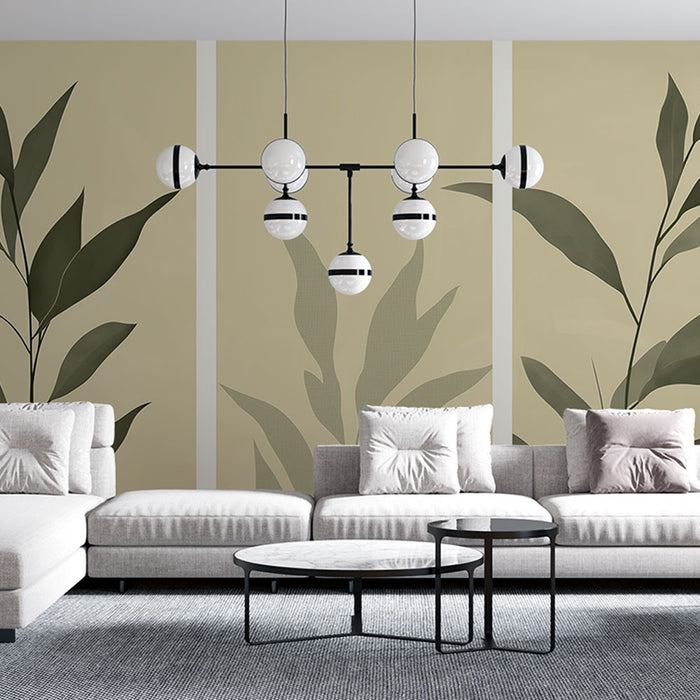 Un salon moderne avec un papier peint aux motifs de grandes feuilles vertes sur fond beige, créant une atmosphère apaisante et naturelle.