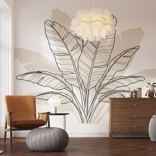 Une pièce moderne avec un papier peint représentant de grandes feuilles stylisées en noir sur un fond beige, créant une ambiance apaisante et naturelle.