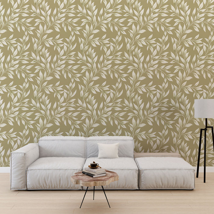 Un salon moderne avec un papier peint aux motifs de feuilles blanches sur fond vert olive, créant une atmosphère apaisante et naturelle.