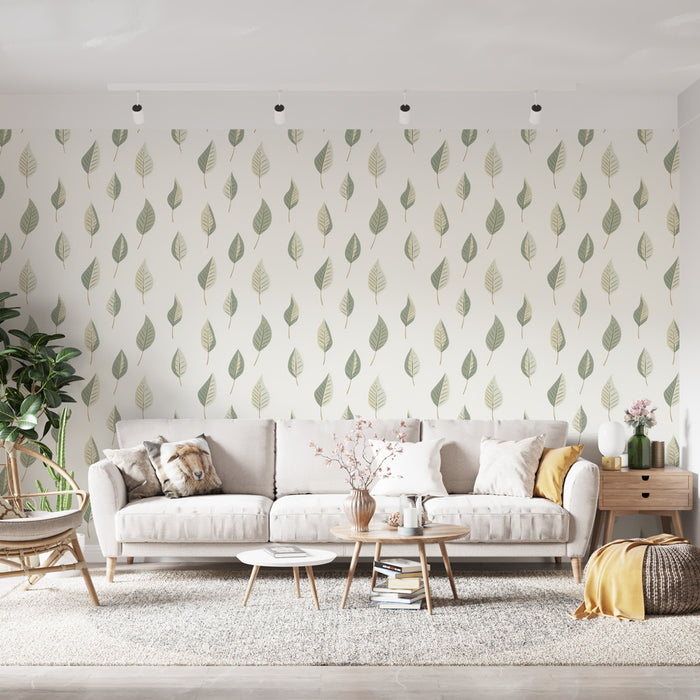 Un salon lumineux avec un papier peint aux motifs de feuilles vertes délicates sur fond clair, créant une ambiance naturelle et apaisante.