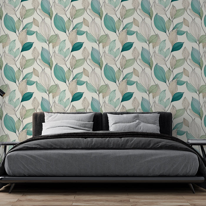 Une chambre moderne avec un papier peint aux motifs de feuilles délicates dans des teintes vertes et beiges, créant une atmosphère apaisante et naturelle.