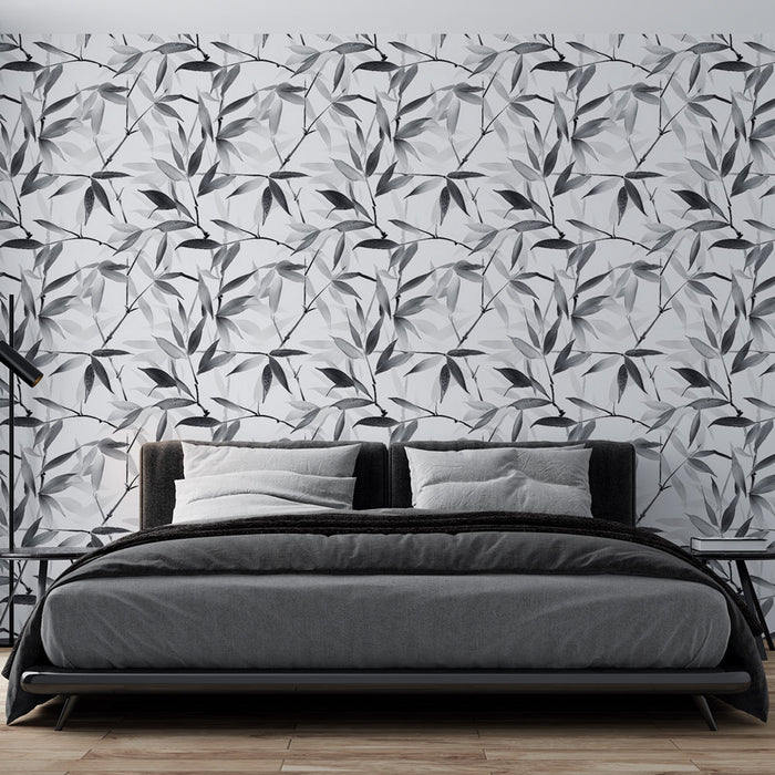 Une chambre moderne avec un papier peint monochrome représentant des feuilles stylisées en noir et blanc, créant une ambiance élégante et apaisante.