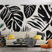 Papier peint feuillage noir et blanc avec motifs de feuilles graphiques pour salon moderne