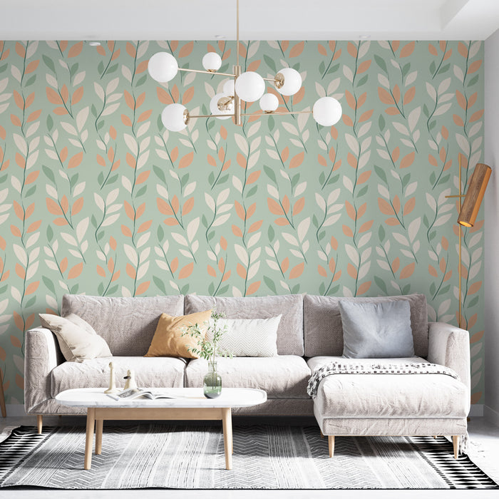 Un salon lumineux avec un papier peint aux motifs de feuilles stylisées dans des teintes douces de vert, crème et pêche, créant une ambiance fraîche et apaisante.