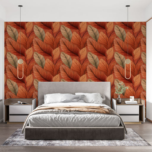 Une chambre moderne avec un papier peint aux motifs de grandes feuilles dans des teintes chaudes de rouge et orange, créant une atmosphère chaleureuse et accueillante.