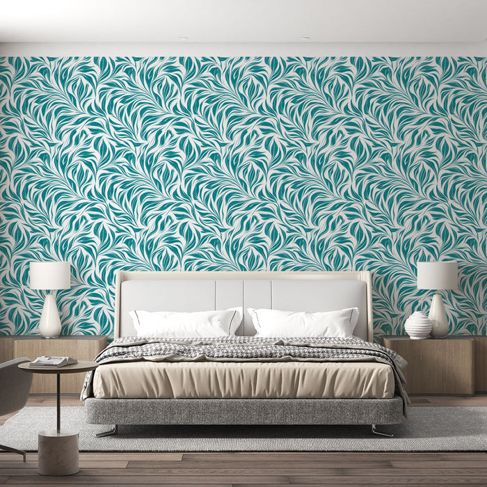 Une chambre moderne avec un papier peint aux motifs de feuilles turquoise sur fond clair, créant une atmosphère fraîche et apaisante.