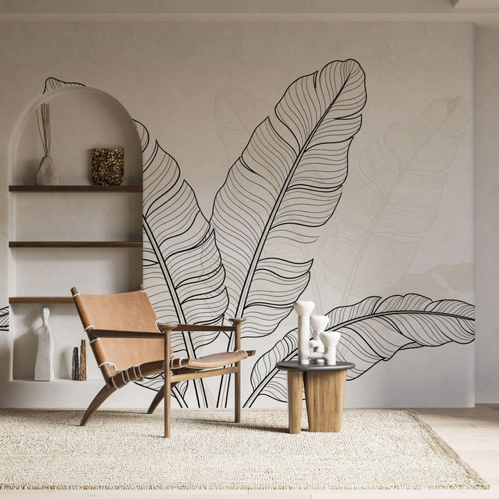 Une pièce lumineuse avec un papier peint représentant de grandes feuilles tropicales en lignes noires sur un fond clair, créant une ambiance naturelle et apaisante.