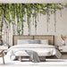 Une chambre moderne avec un papier peint illustrant des lianes vertes stylisées sur fond clair, créant une atmosphère naturelle et apaisante.