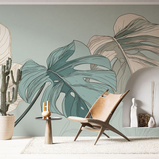 Une pièce moderne avec un papier peint tropical aux grandes feuilles stylisées en vert et beige, créant une atmosphère apaisante et naturelle.