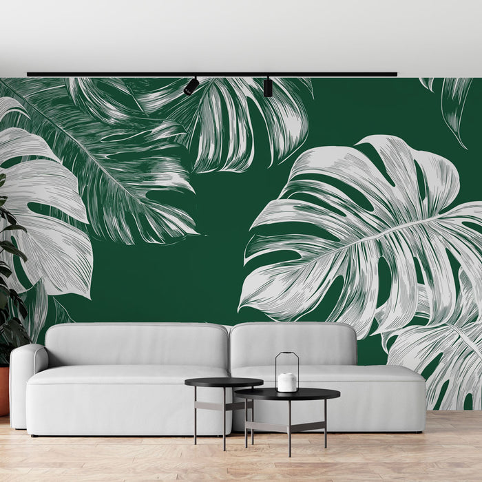 Un salon moderne avec un papier peint tropical vert profond orné de grandes feuilles blanches, créant une atmosphère vivante et apaisante.