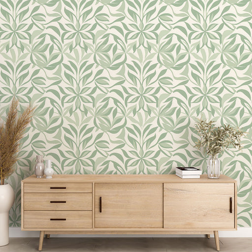 Une pièce moderne avec un papier peint floral vert doux sur fond crème, créant une atmosphère apaisante et naturelle.