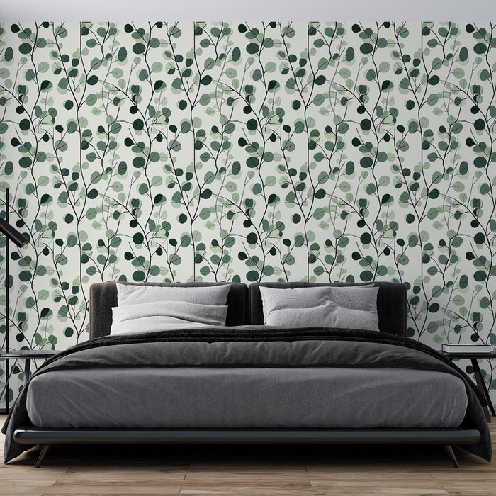 Une chambre moderne avec un papier peint aux motifs de feuillage vert et noir sur fond clair, créant une atmosphère apaisante et naturelle.