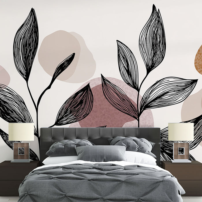 Une chambre moderne avec un papier peint aux motifs de feuilles stylisées en noir et des formes géométriques douces dans des teintes pastel, créant une atmosphère apaisante et élégante.