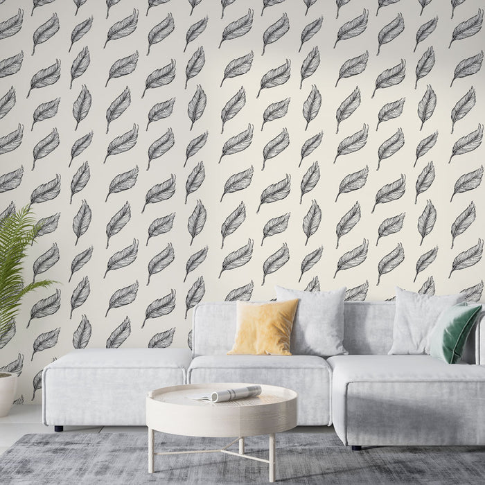 Un salon moderne avec un papier peint représentant des feuilles délicates en noir sur fond crème, créant une atmosphère apaisante et naturelle.