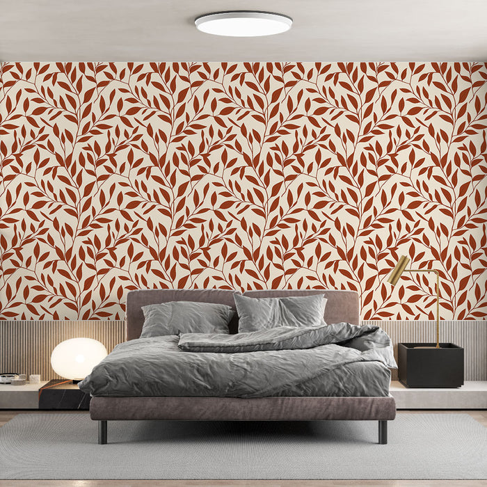 Une chambre moderne avec un papier peint aux motifs de feuilles stylisées en terracotta sur fond crème, créant une atmosphère chaleureuse et accueillante.