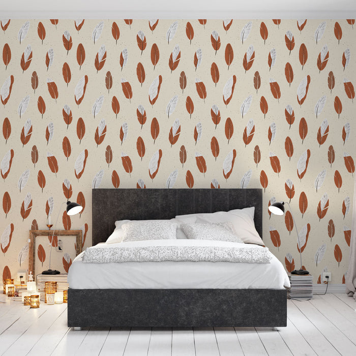 Une chambre moderne avec un papier peint aux motifs de feuilles stylisées dans des teintes rouges et blanches sur fond crème, créant une atmosphère chaleureuse et accueillante.