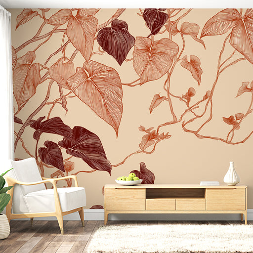 Un salon moderne avec un papier peint représentant des feuilles stylisées en rouge et beige, créant une atmosphère chaleureuse et naturelle.