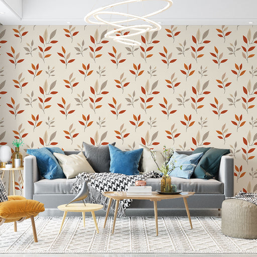 Un salon contemporain avec un papier peint floral beige orné de feuilles rouges et grises, créant une atmosphère chaleureuse et accueillante.