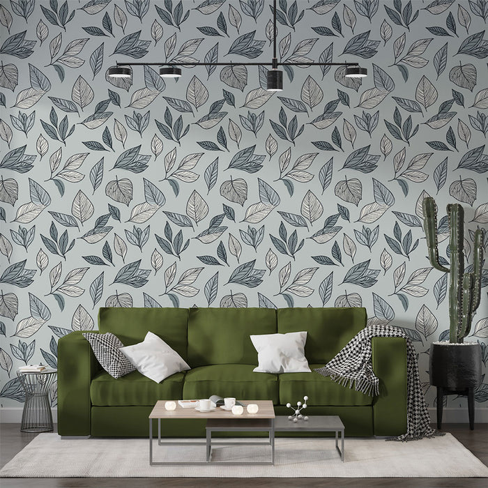 Un salon contemporain avec un papier peint aux motifs de feuilles délicates dans des teintes de bleu et beige, créant une atmosphère apaisante et naturelle.