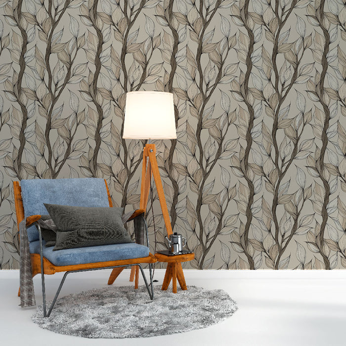Un salon moderne avec un papier peint aux motifs de feuilles délicates dans des teintes neutres créant une ambiance apaisante et naturelle.