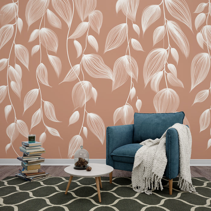 Une pièce moderne avec un papier peint terracotta orné de délicates feuilles blanches, créant une ambiance chaleureuse et accueillante.