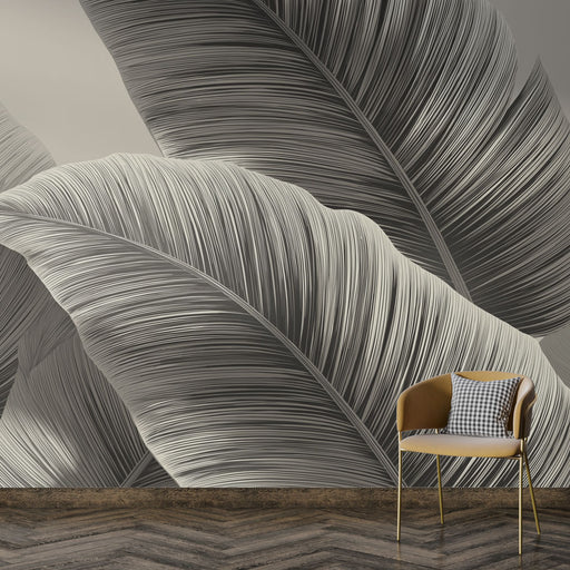 Une pièce moderne avec un papier peint représentant de grandes feuilles stylisées en noir et blanc, créant une ambiance élégante et apaisante.