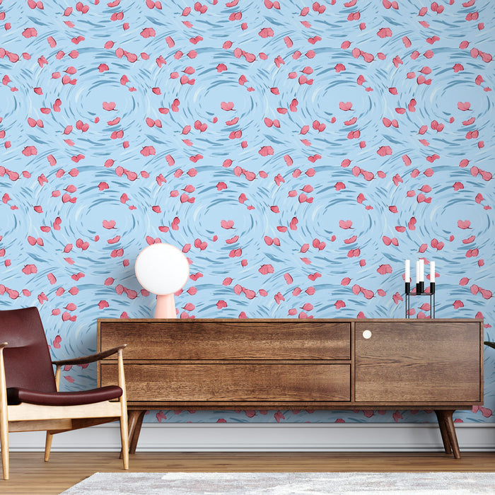 Une pièce moderne avec un papier peint bleu clair orné de motifs de pétales roses flottants, créant une ambiance douce et apaisante.