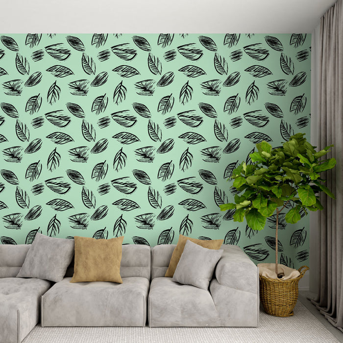Un salon moderne avec un papier peint mint orné de feuilles noires stylisées, créant une ambiance fraîche et naturelle.