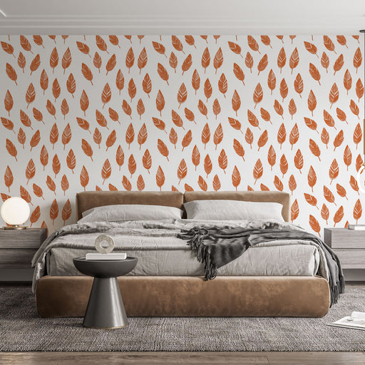 Une chambre moderne avec un papier peint aux motifs de feuilles orange sur fond blanc, créant une ambiance chaleureuse et naturelle.