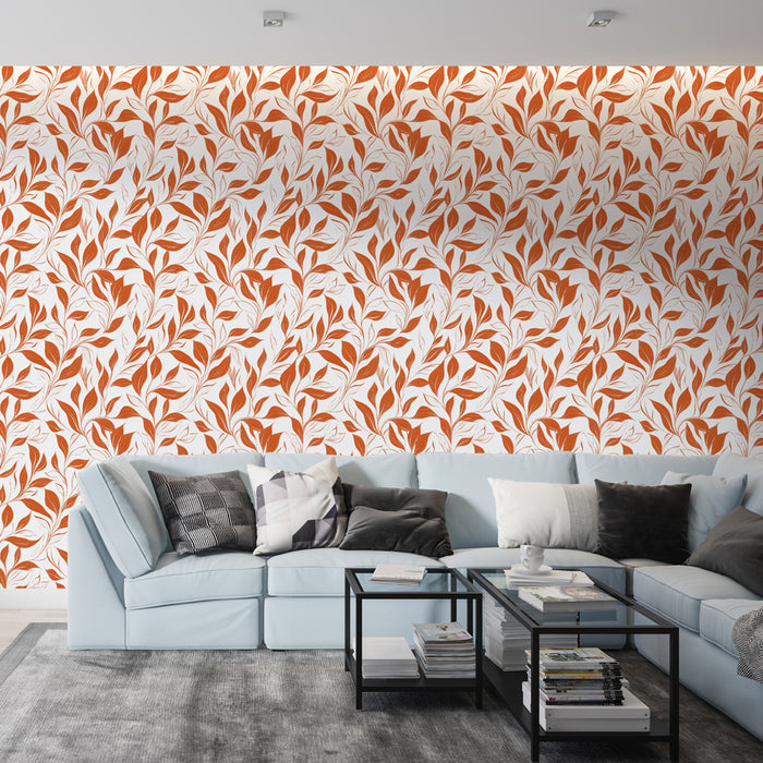 Un salon contemporain avec un papier peint floral aux motifs de feuilles orange sur fond blanc, créant une ambiance chaleureuse et accueillante.