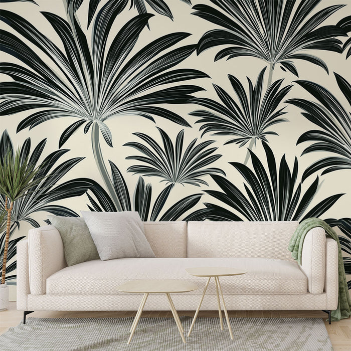 Un salon contemporain avec un papier peint tropical noir et blanc représentant de grandes feuilles exotiques sur un fond clair, créant une atmosphère élégante et apaisante.