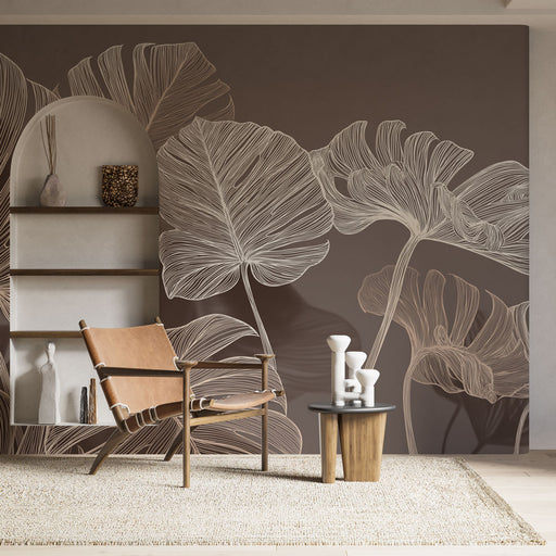 Une pièce moderne avec un papier peint représentant de grandes feuilles blanches sur fond brun, créant une ambiance élégante et apaisante.