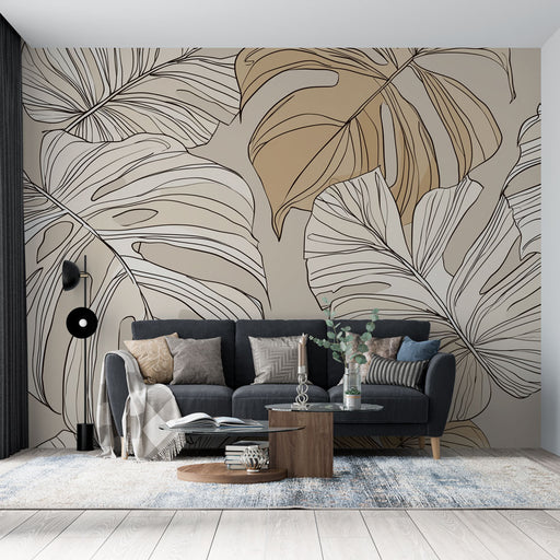 Un salon moderne avec un papier peint représentant de grandes feuilles tropicales aux teintes beige et noir, créant une ambiance chaleureuse et accueillante.